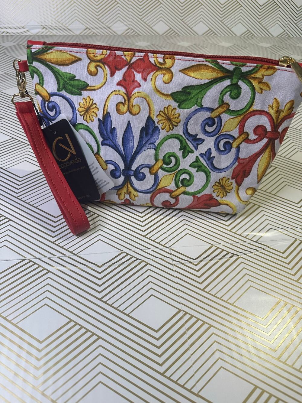 NWT Capoverde Italia wristlet/cosmetic pouch with a detachable leather strap.